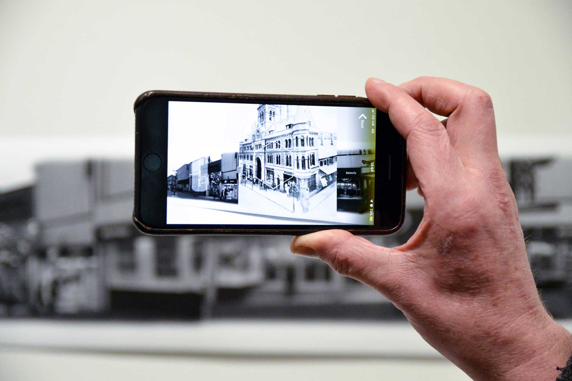 Someone using their phone on the interactive exhibition at Market gallery