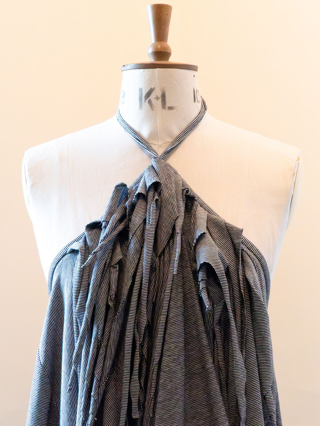 The top of a dress on a mannequin.