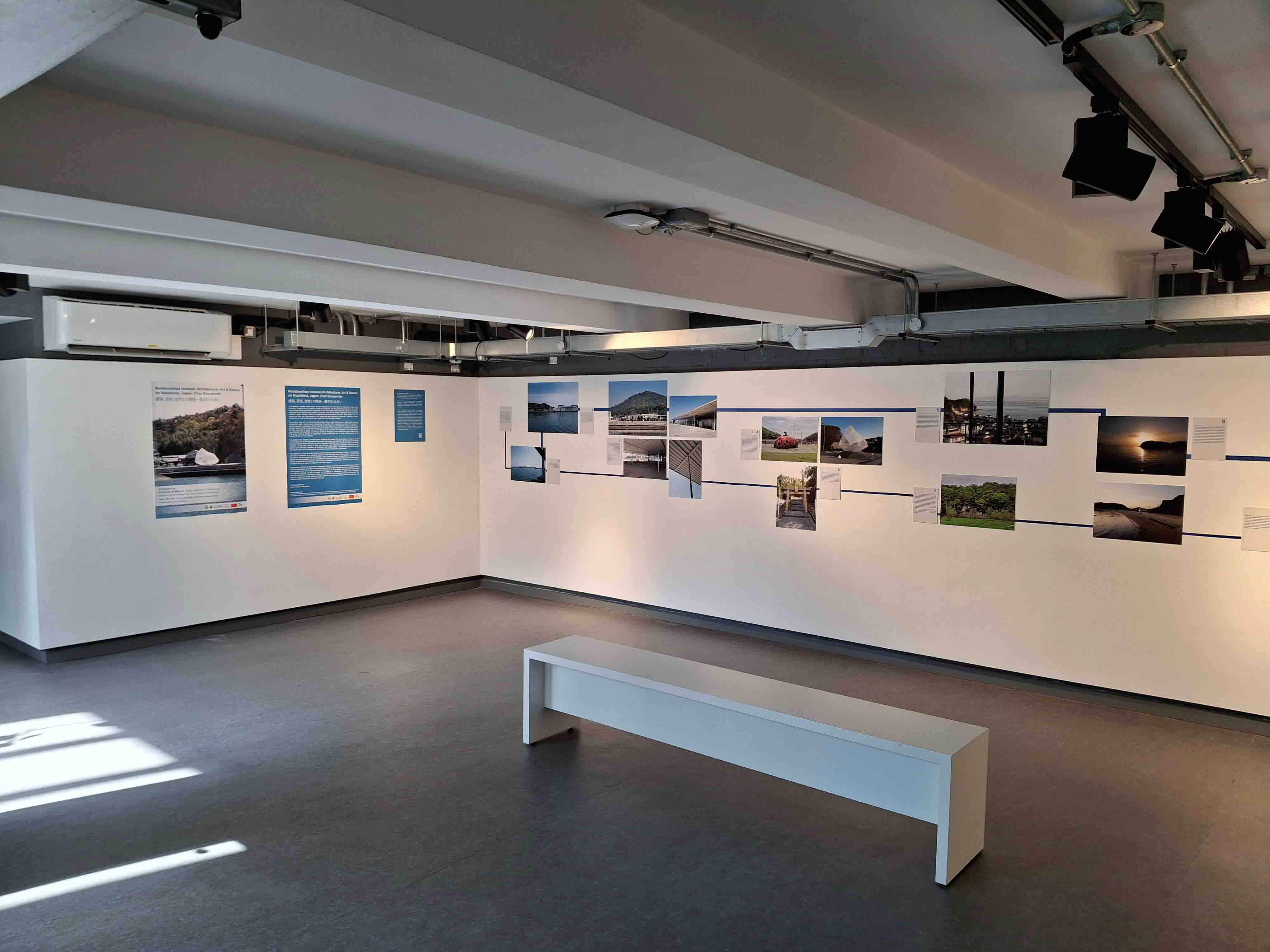 A picture of an exhibition space with prints on the walls depicting photos of Japan