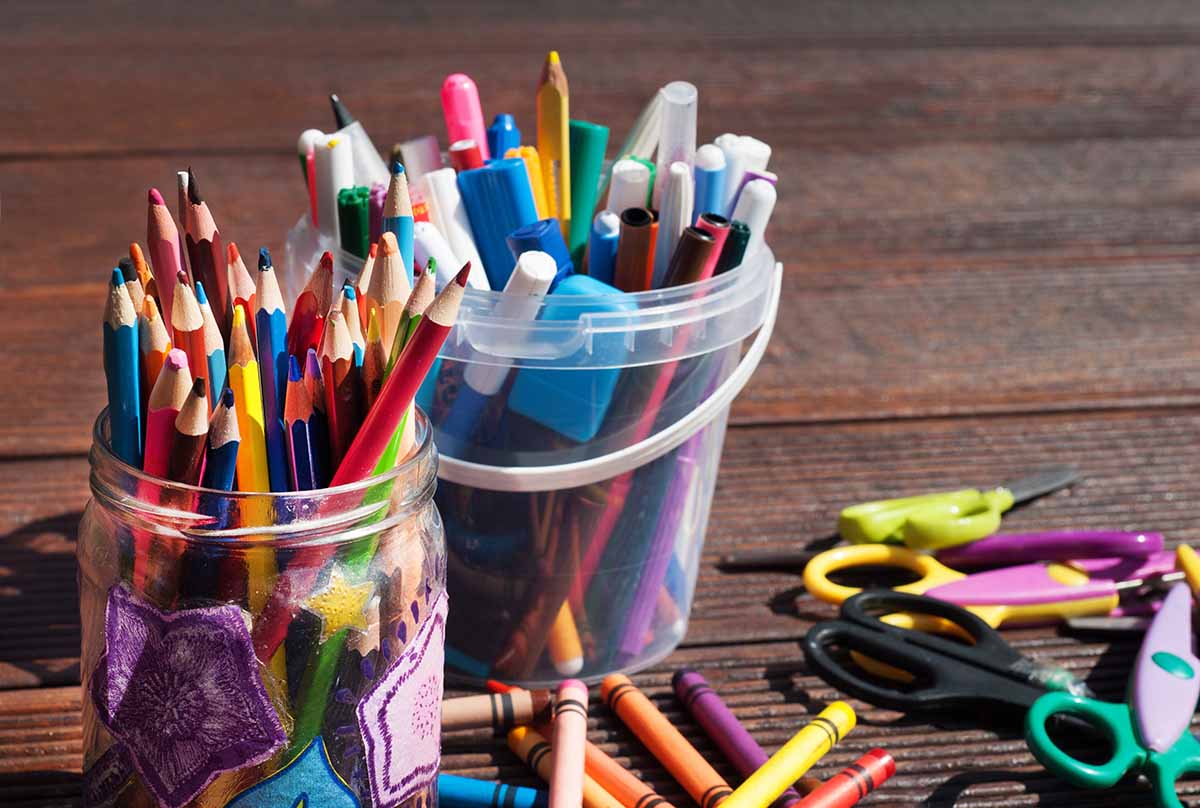 Image of children's craft supplies, crayons and felt tips