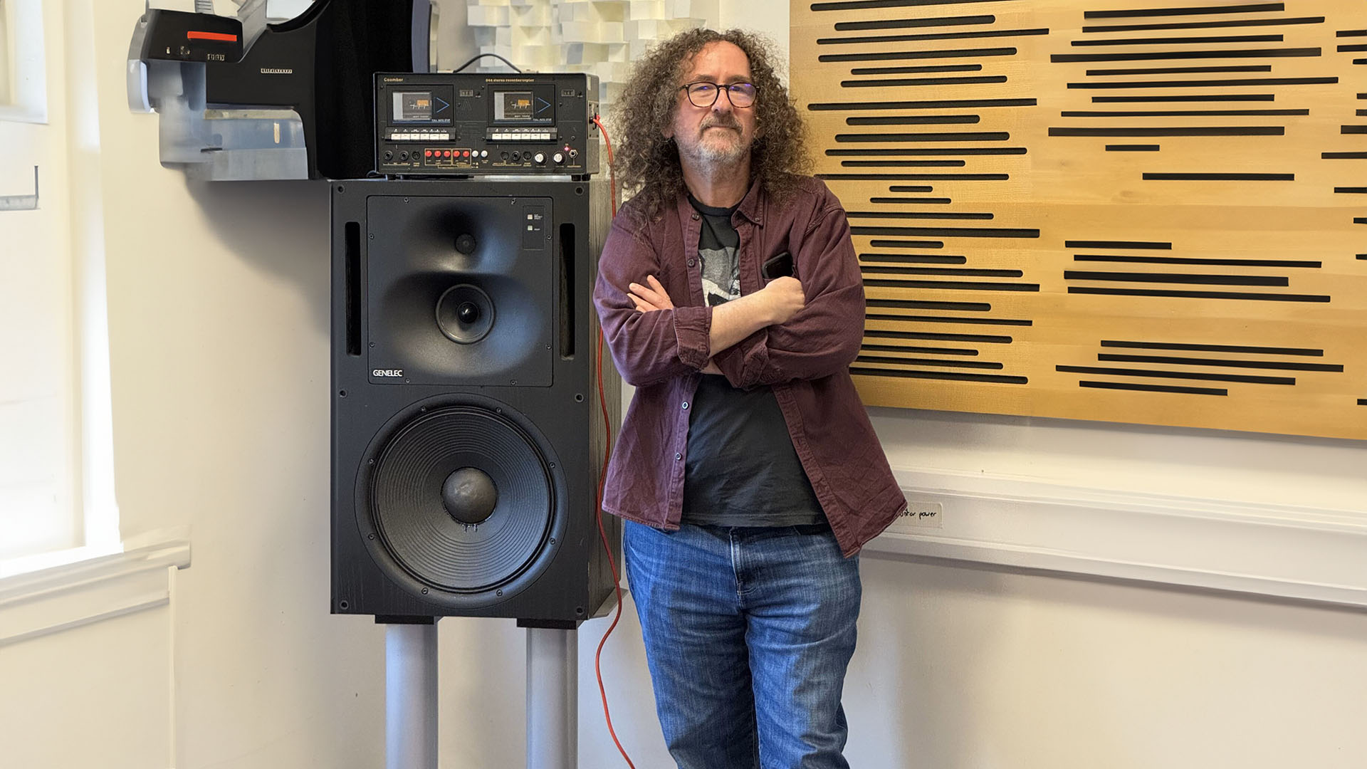 Prof Steve standing next to a speaker